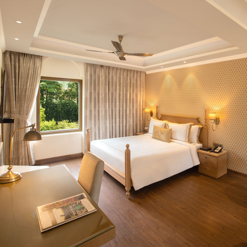 suite in manesar with a comfy king size bed, lavish interiors and wooden flooring