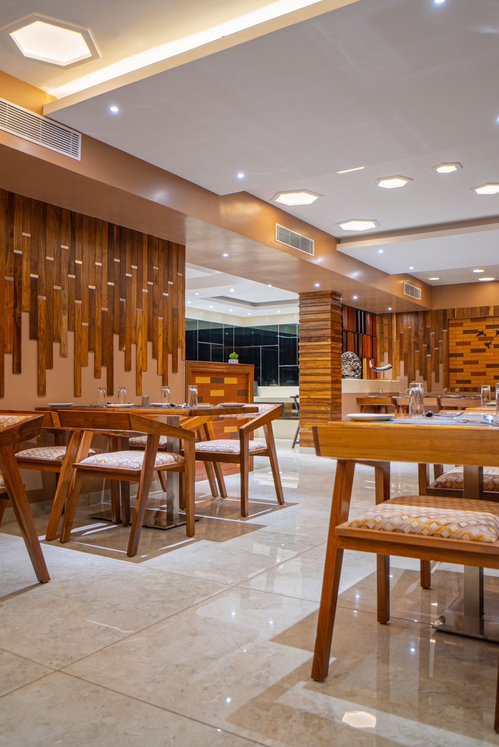 Brown desks and chairs in Honeycomb Restaurant u3rcfz