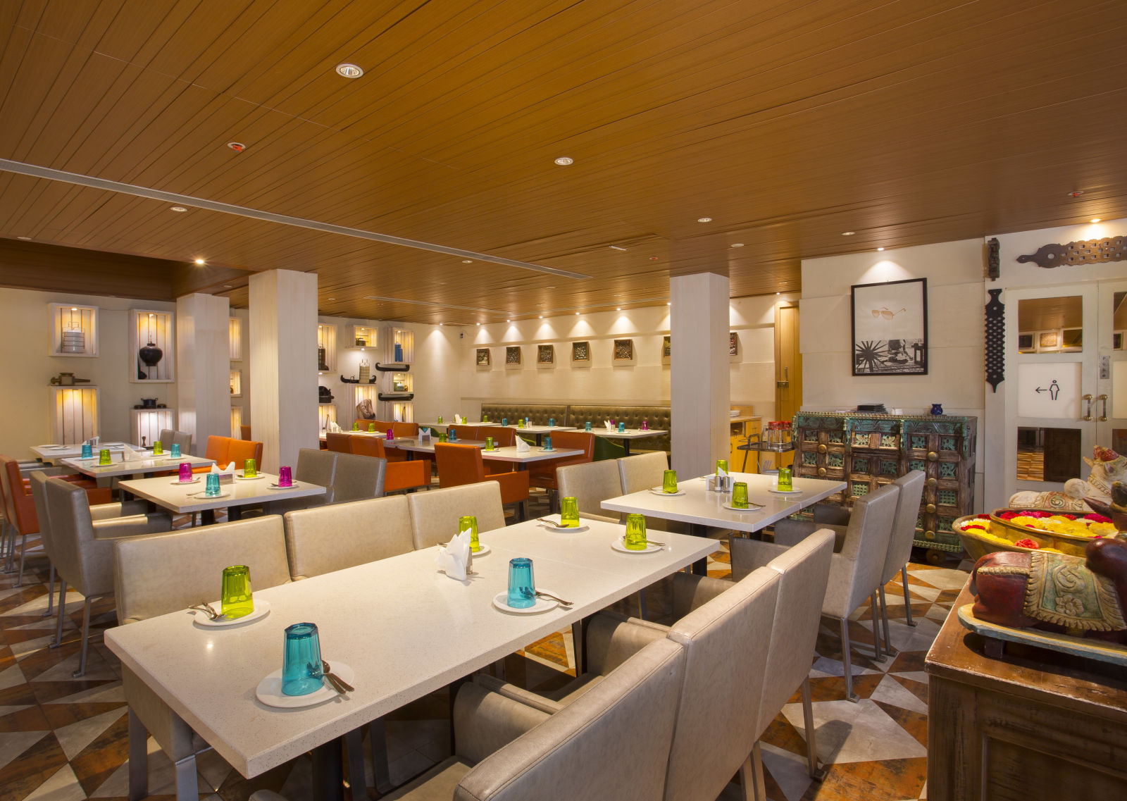 view of a restaurant with rows of rectangular tables with chairs on the long sides - Hotel Fountain Tree By TGI - JP Nagar, Bangalore