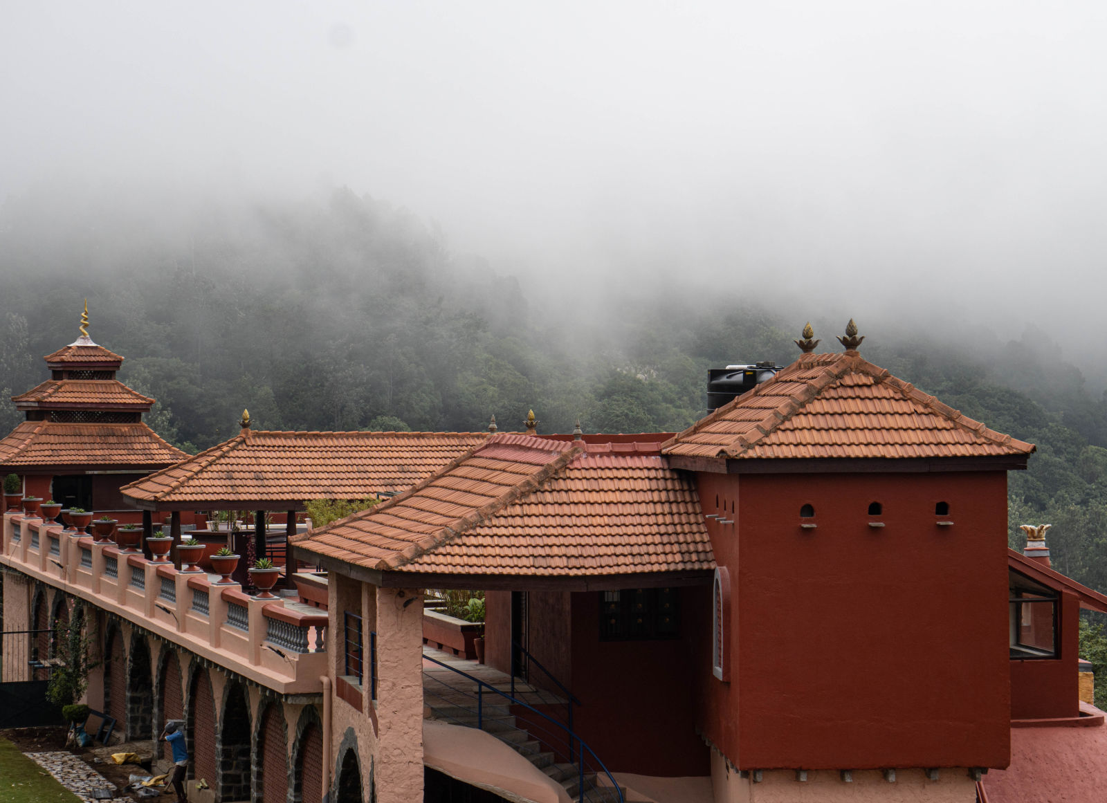 A beautiful facade of the resort with mist around at mango hill resort, yercaud