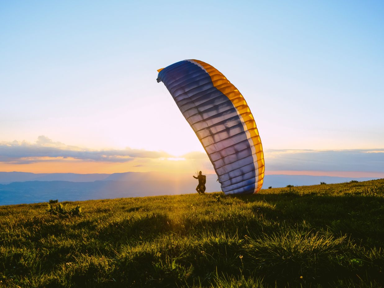 Paragliding under clear blue sky