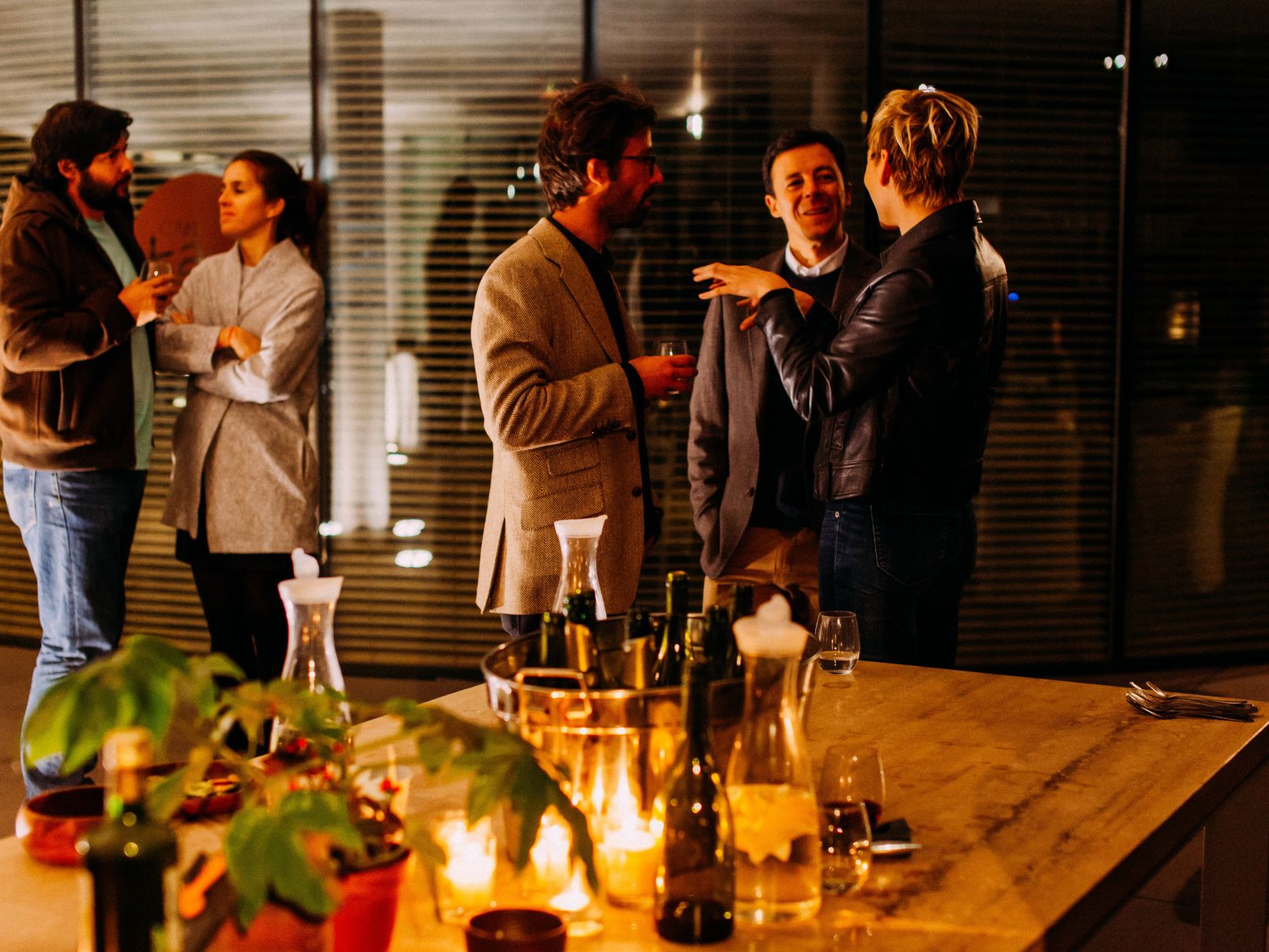 people talking in a dimly lit room