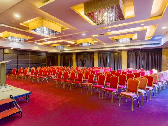 Banquet Hall at GIS Select furnished with red chairs and modern amenities 2