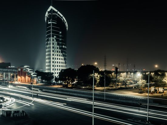 night view of a city with tall buildings and bright lights