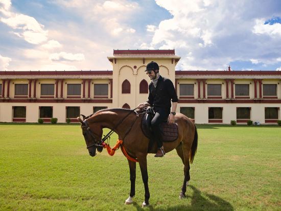 Ummed Hotels - A person sitting on a horse