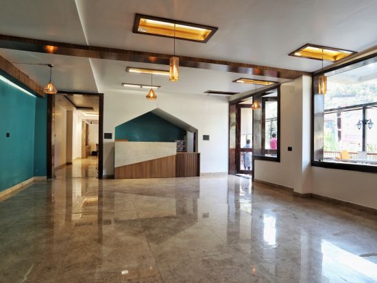 A spacious hall with large windows and soothing ambient lighting - Vinsober Monal, Nainital