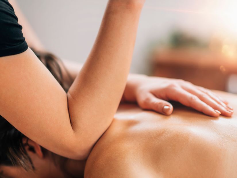 Image of a woman getting a back massage