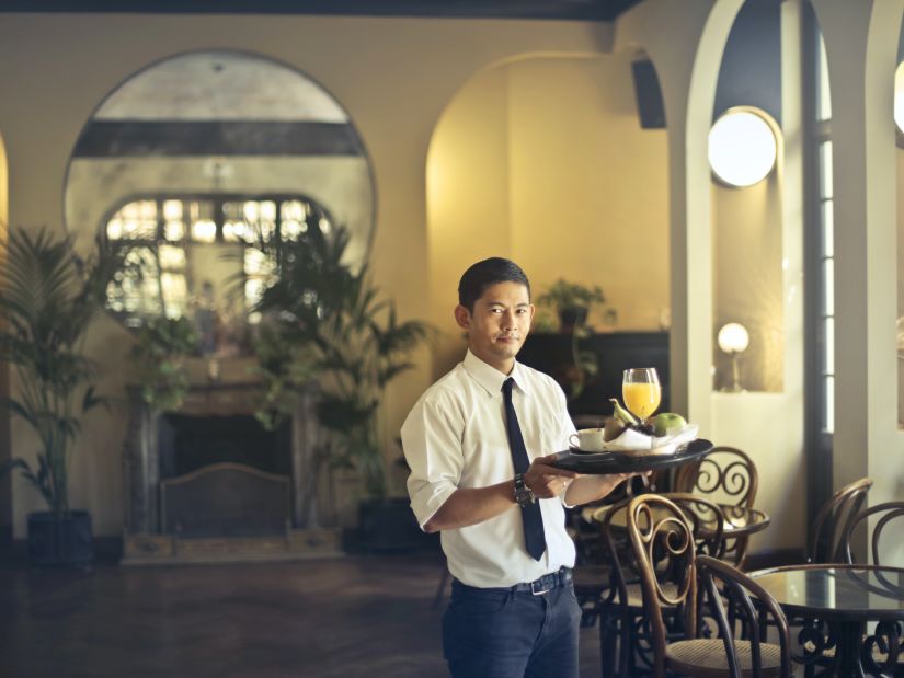 Waiter with a tray @ Lamrin Ucassaim Hotel, Goa