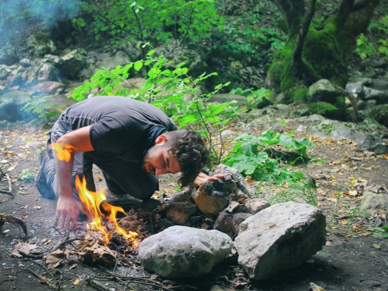 a person learning survival techniques in the wild