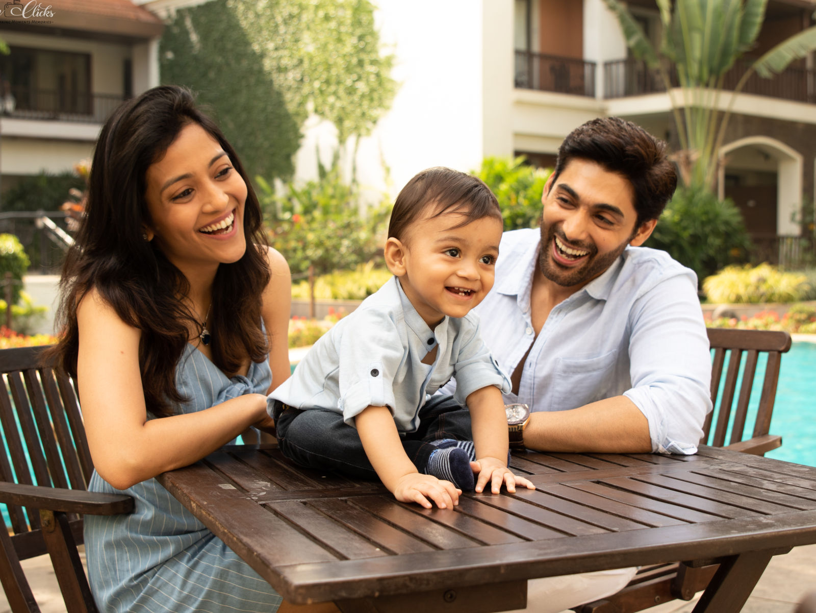 Parents spends time with their baby on the resort