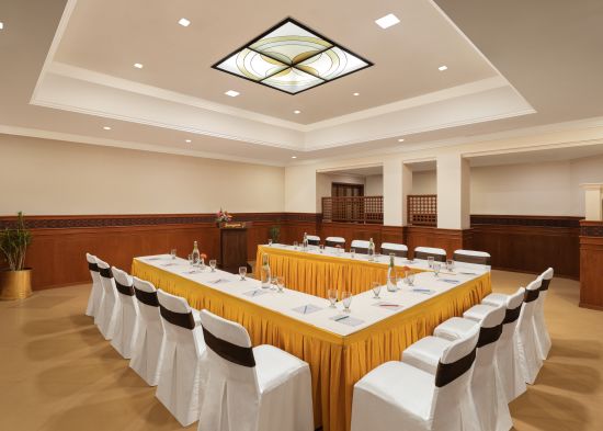 alt-text Seating arrangement in Shruti Hall at Sangam Hotel, Thanjavur