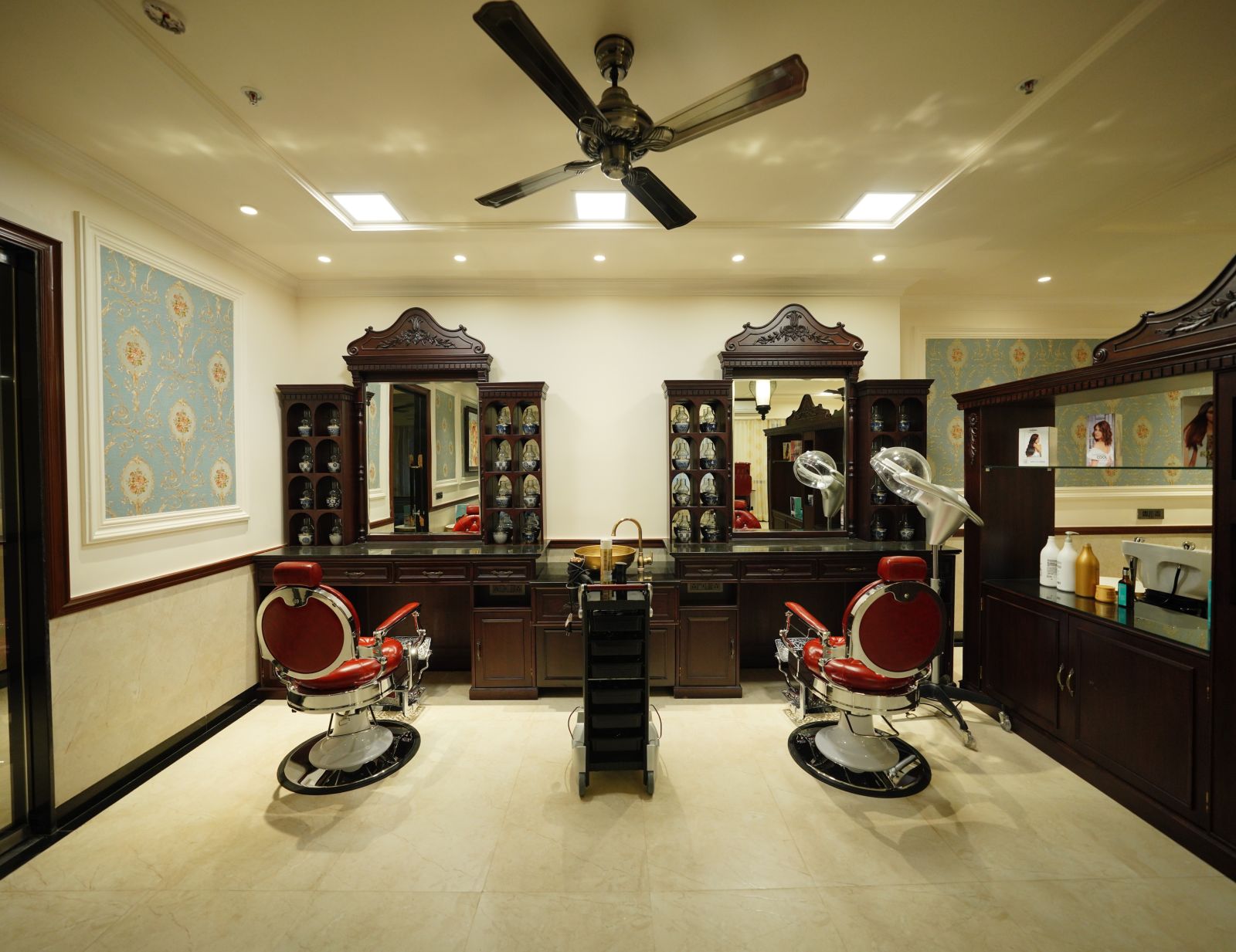 two mirrors and two rolling salon chairs - Mayfair Tea Resort, Siliguri 1