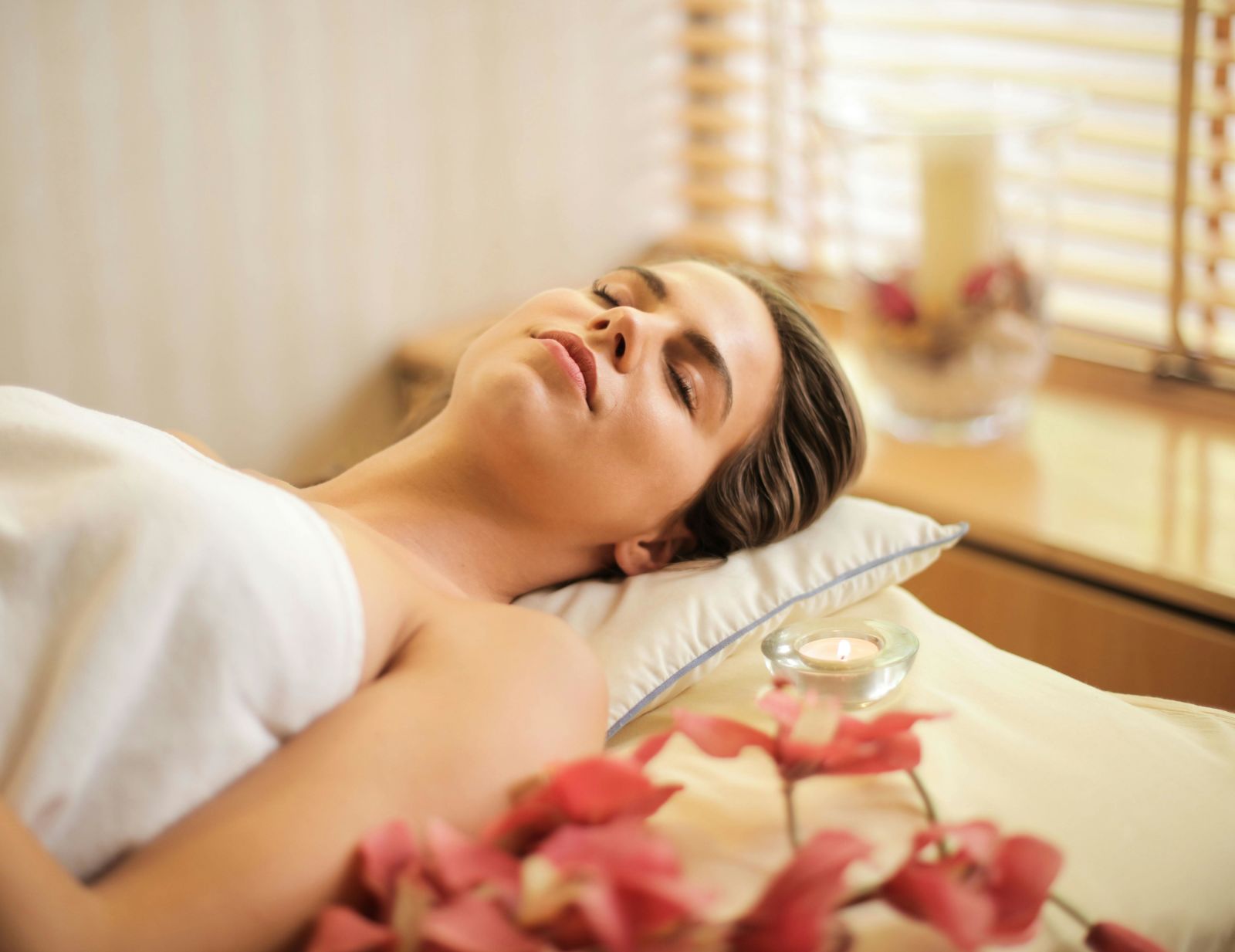 Image of a woman lying on a bed in a spa