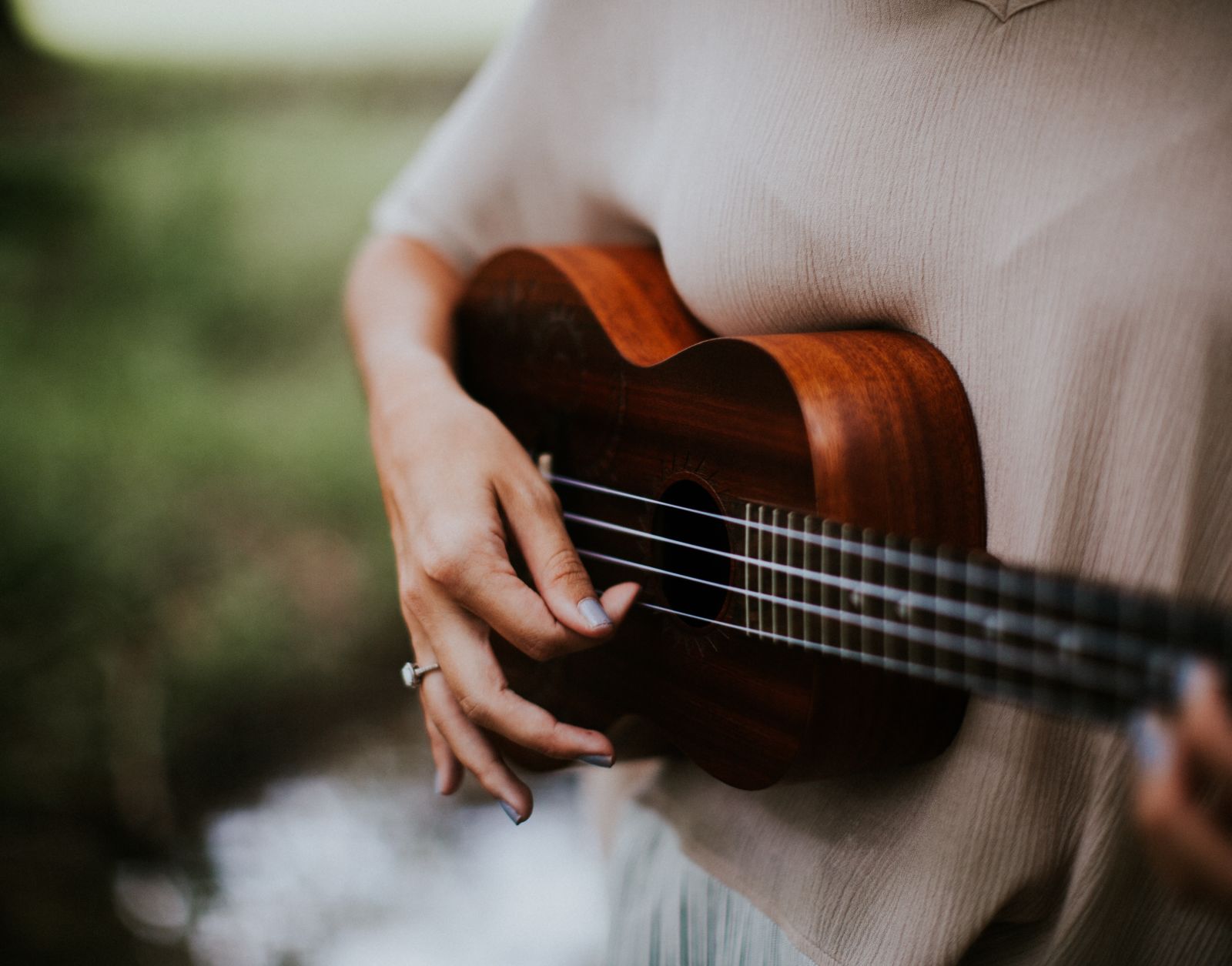 a lady playing ukulele