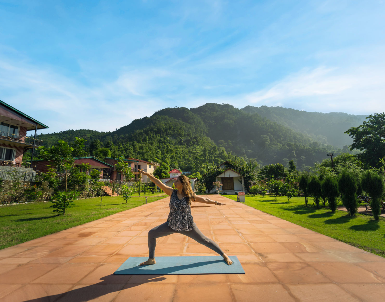 a woman doing yoga in an open area 