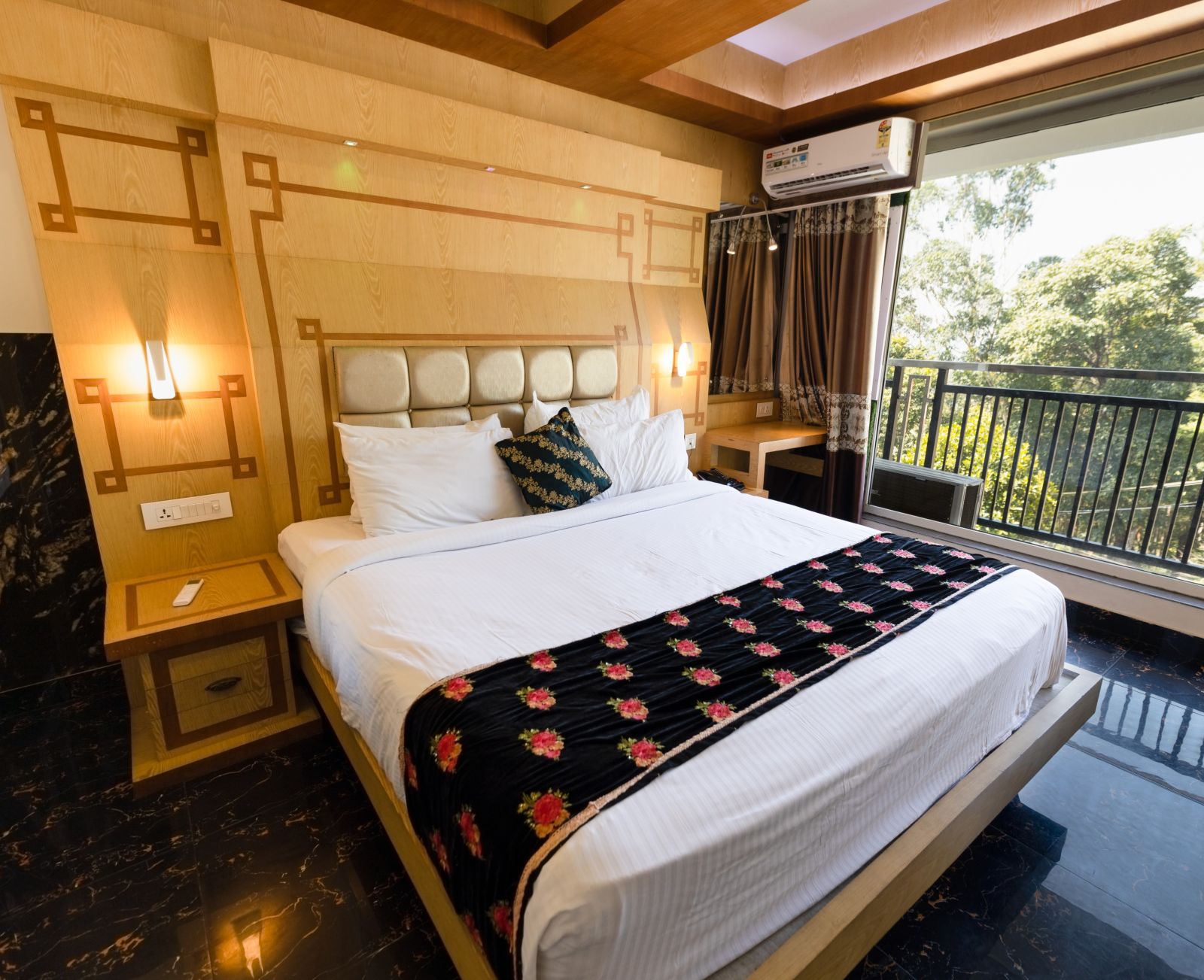 Wide view of the double bed in the Superior Room at Parakkat Nature Hotel and Resorts Munnar 1