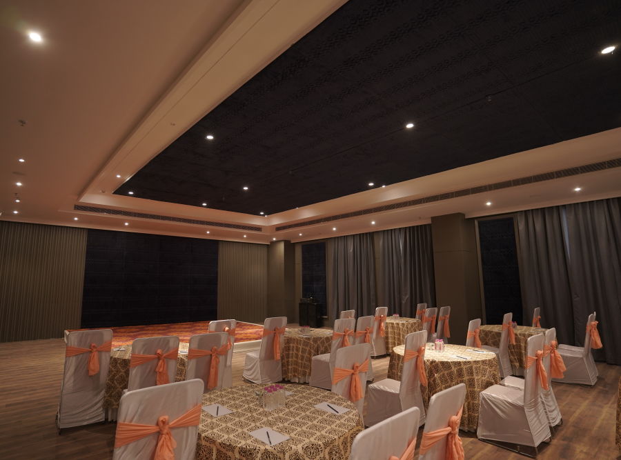 alt-text banquet hall with chairs and tables at Classic Sapphire by Ananta