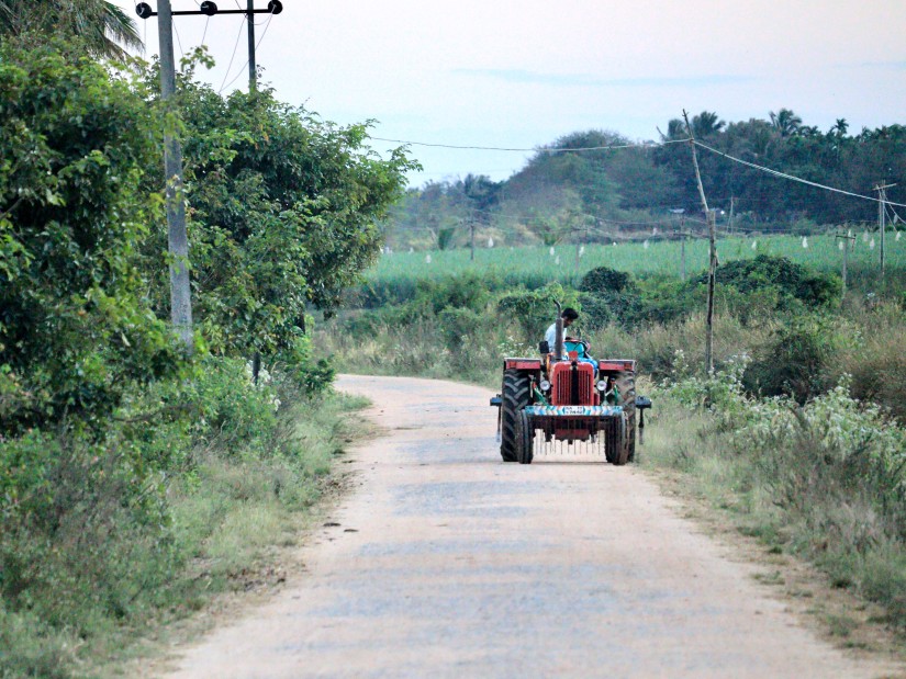 a tractor on a farm road