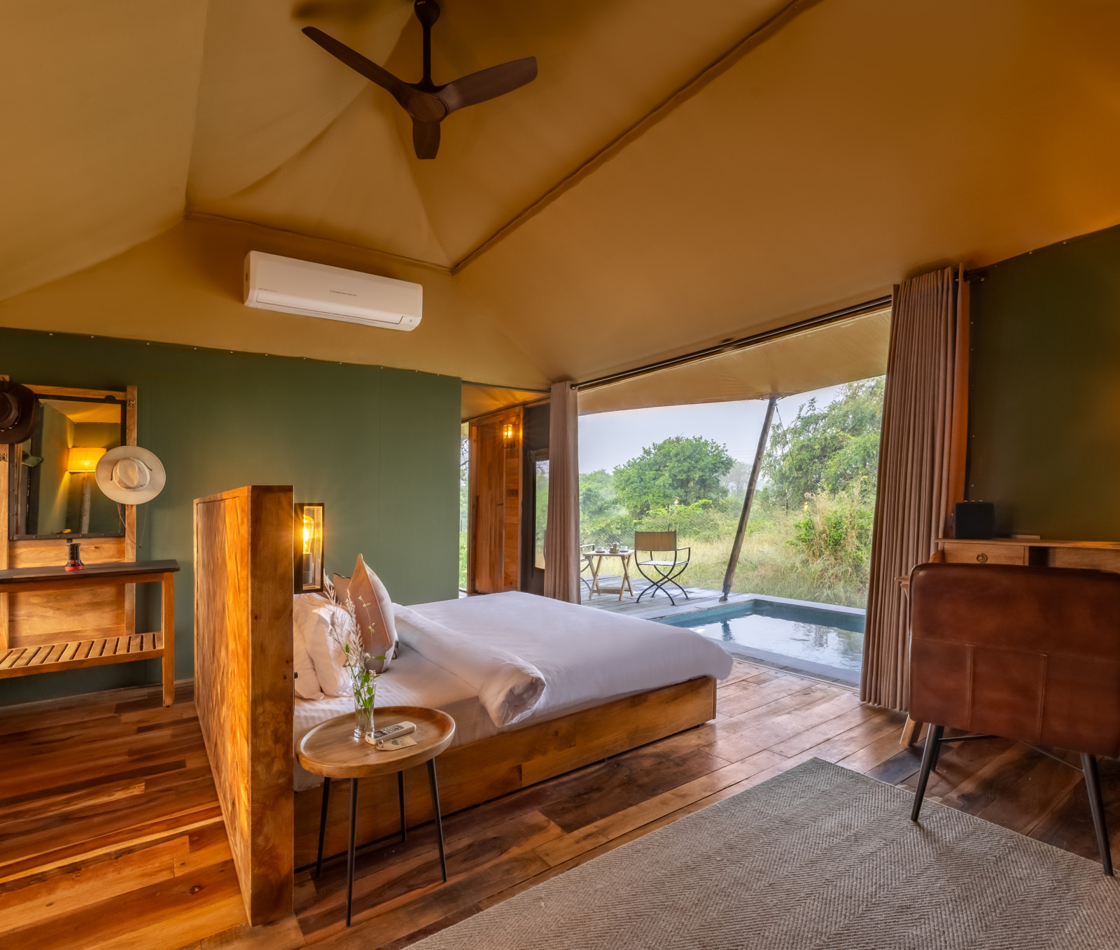 interior of a room with double bed at Trees N Tigers Tadoba