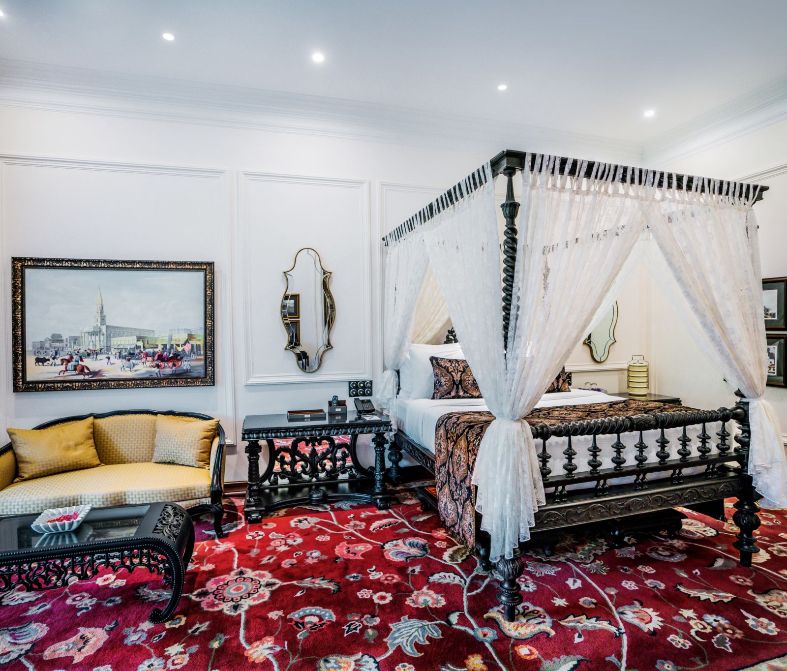 view of a king size bed and a sofa set at its left side - Mayfair Tea Resort, Siliguri