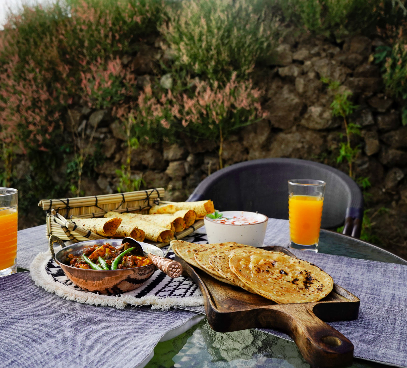 dishes kept on a table in th outdoor seating area at our Restaurant in Rishikesh