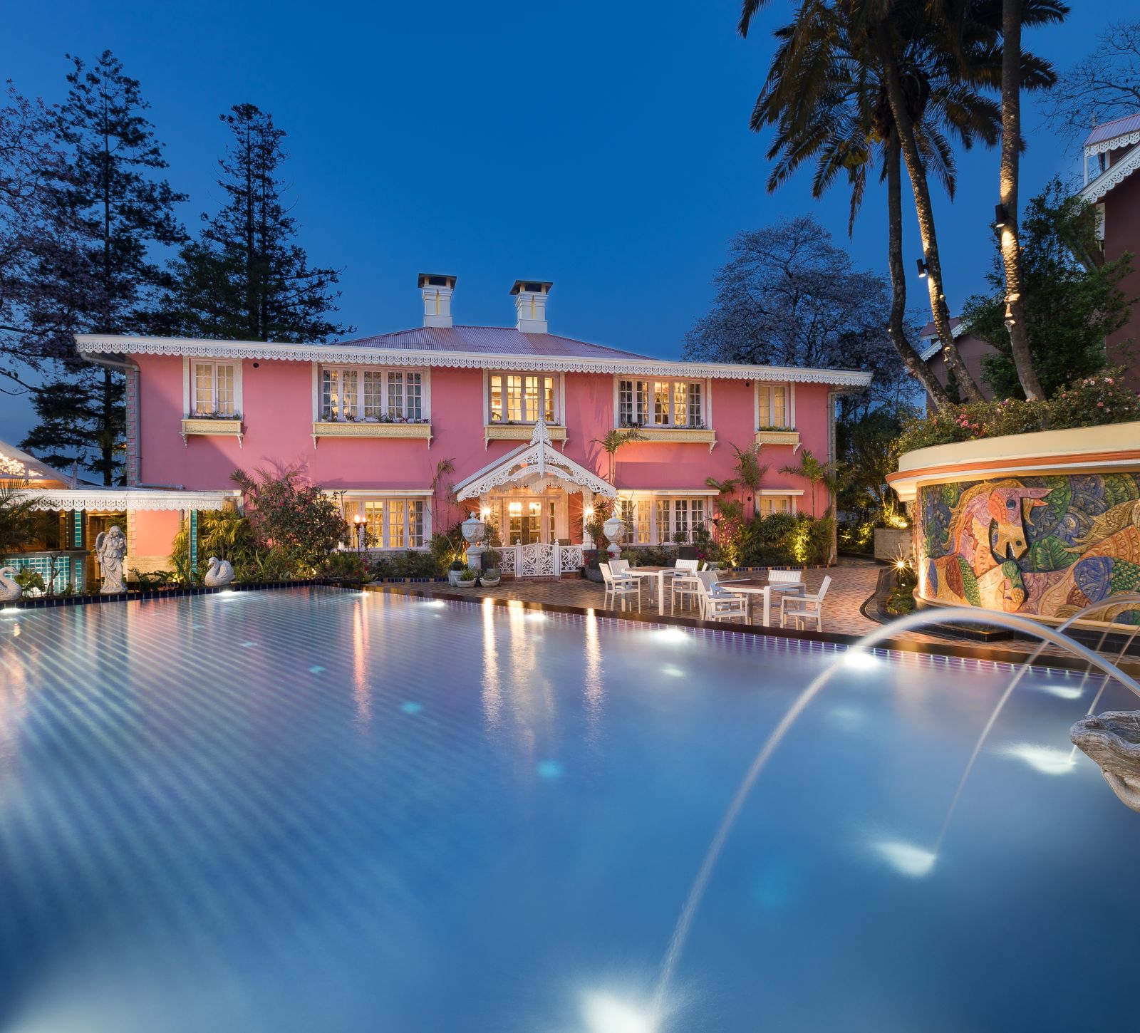 the swimming pool at night time - Mayfair Himalayan Spa Resort Kalimpong