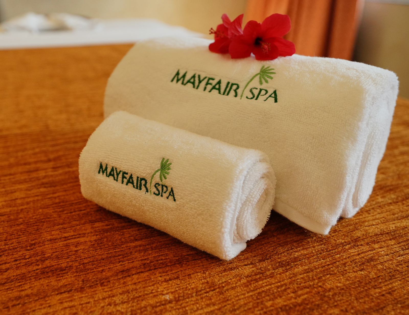 two folded towels with the name mayfair spa printed on them - Mayfair Tea Resort, Siliguri 