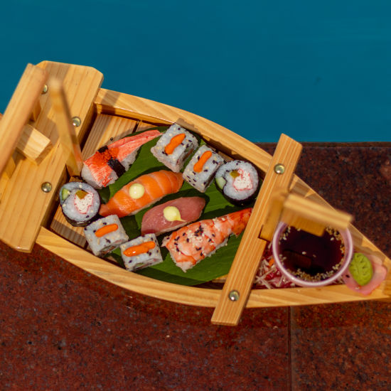 a platter of sushi and other seafood dishes