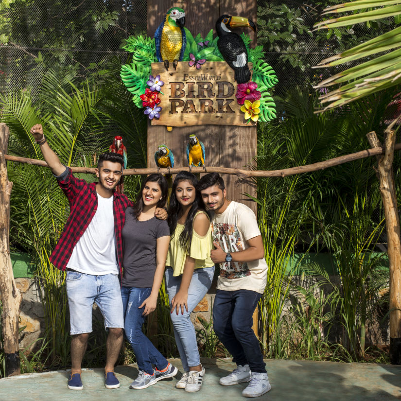 bird park esselworld,  a group taking a picture in front of the logo of bird park