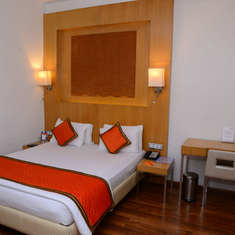 Superior Room with bed work desk and large windows - Citrus Classic Bengaluru