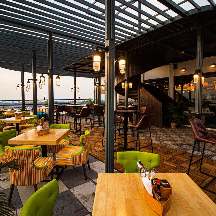 the seating area at the outside deck - polo floatel kolkata