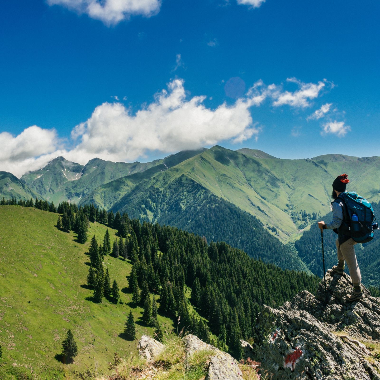 A person standing at the edge of a cliff