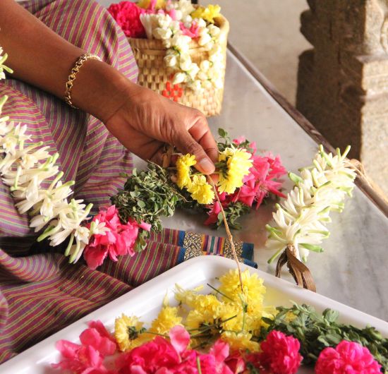 alt-text Flower Garland preparation at Chidambara Vilas