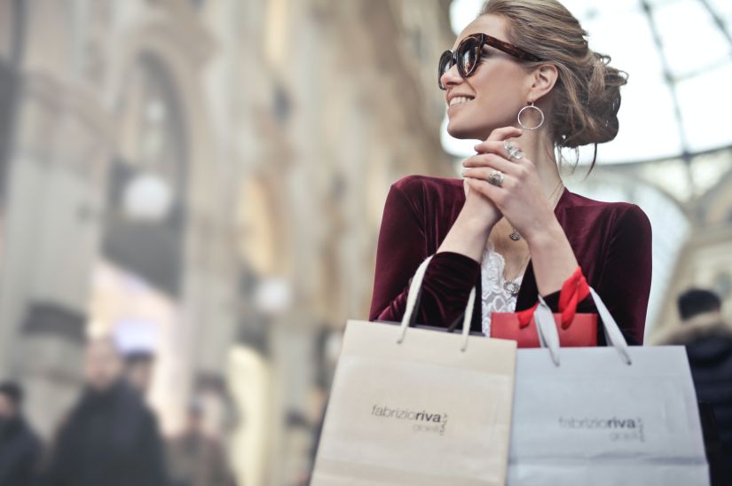 person holding shopping bags