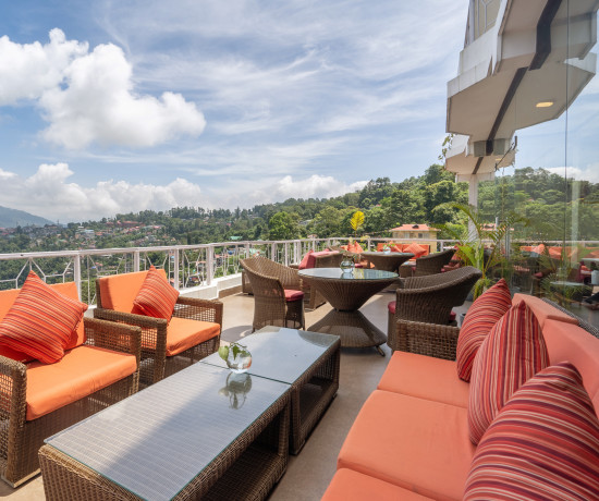 alt-text rooftop seating area at summit lillium hotel and spa