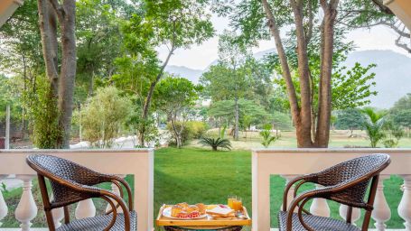 chairs and a coffee table in between the chairs in the balcony - Black Thunder, Coimbatore