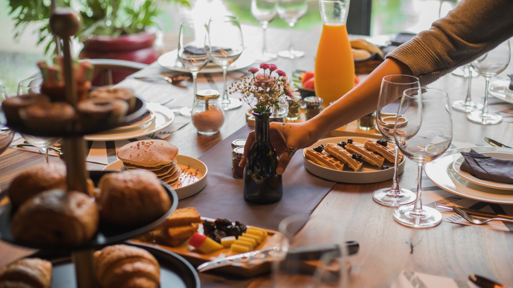 Breakfreast Spread on a huge table with different kinds of baked delicacy  