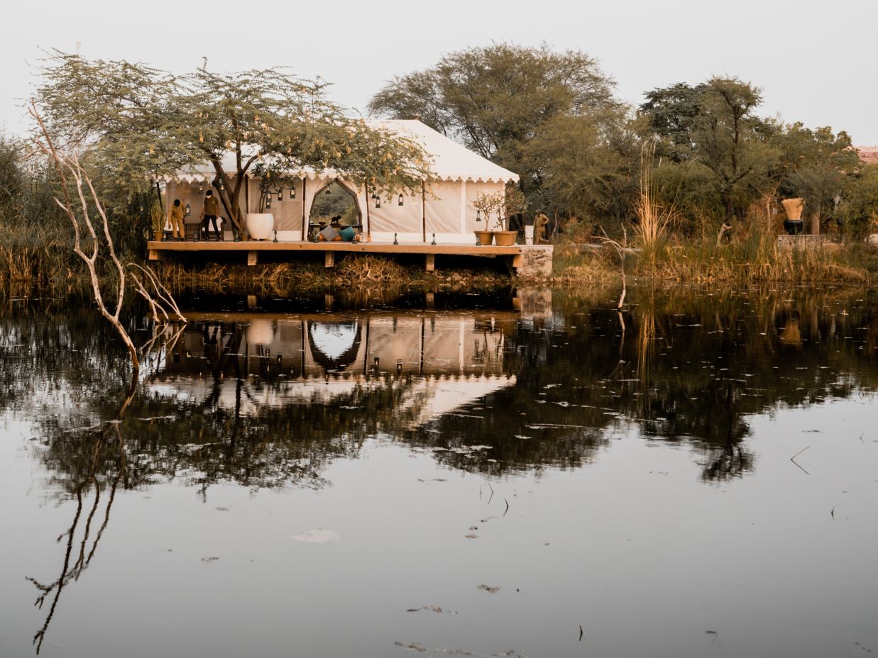 The Blackbuck Lodge Velavadar - exterior view of luxurious rooms facinng a lake2