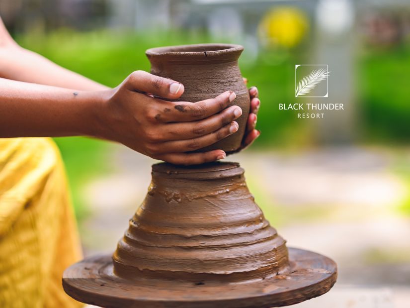 a person making a clay pot - Black Thunder, Coimbatore