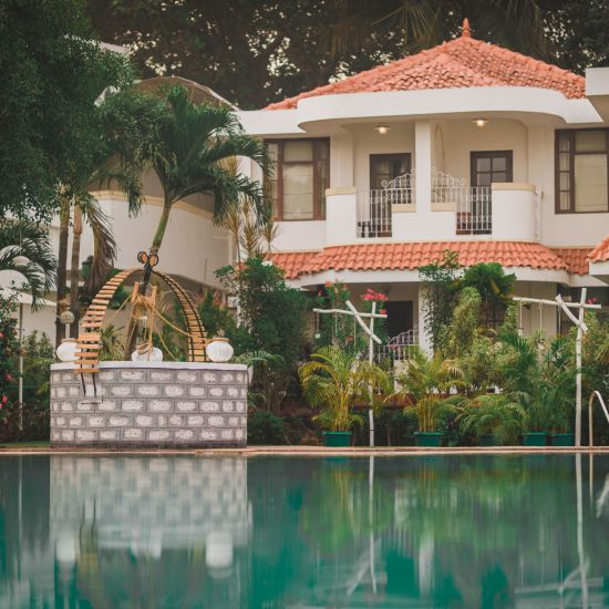 exterior of a beautiful resort with swimming pool in goa