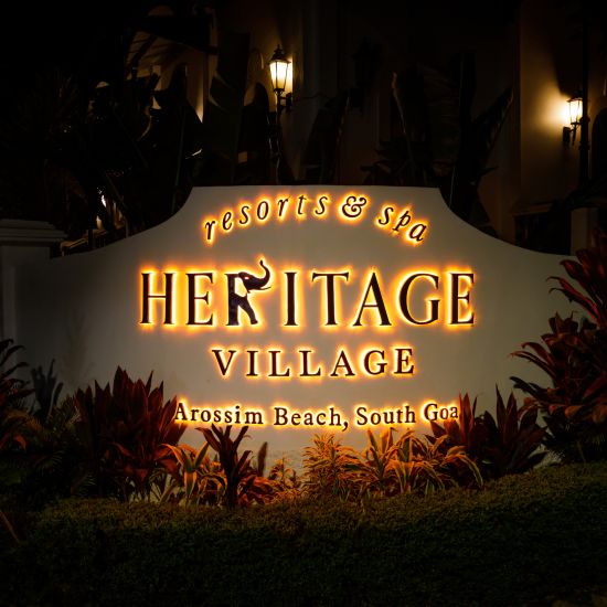 heritage village resort and spa in goa signboard