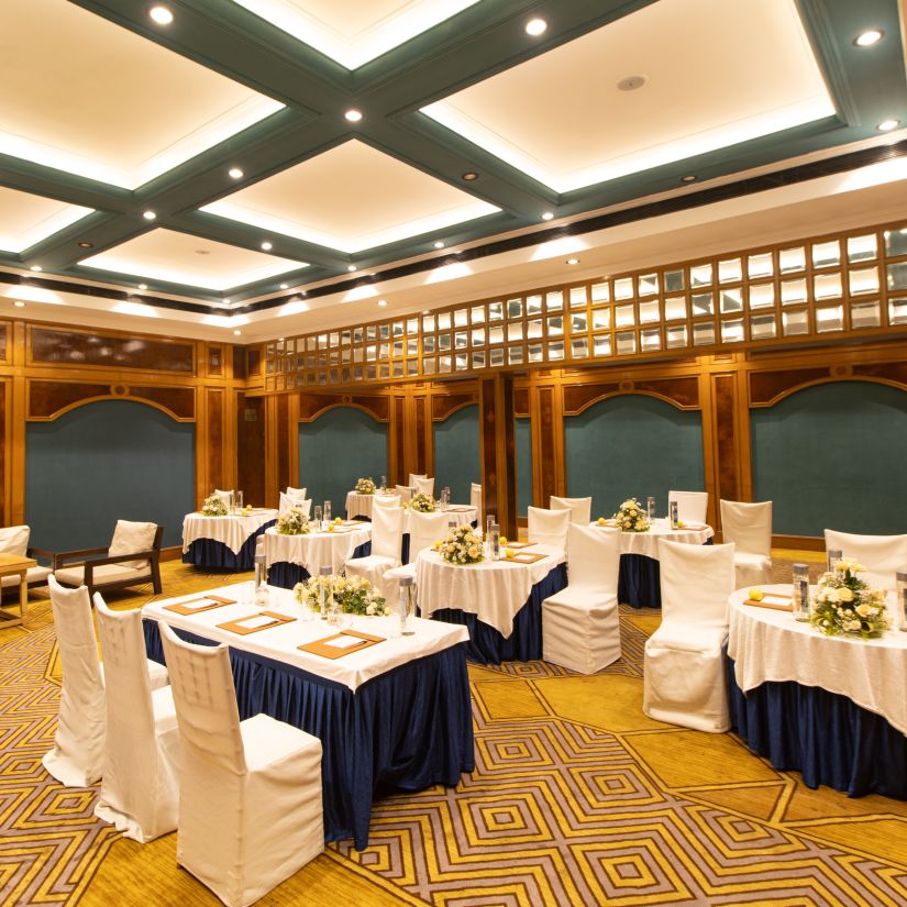 State Room - Sophisticated banquet hall with decorative ceiling, patterned carpet, and round tables for events -  Polo Floatel Kolkata