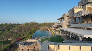 side view of Chunda Shikar Oudi with the swimming pool and forest cover with the blur sky in the background