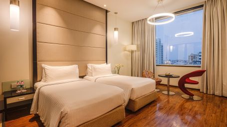 rooms with twin beds at E Hotel, Chennai