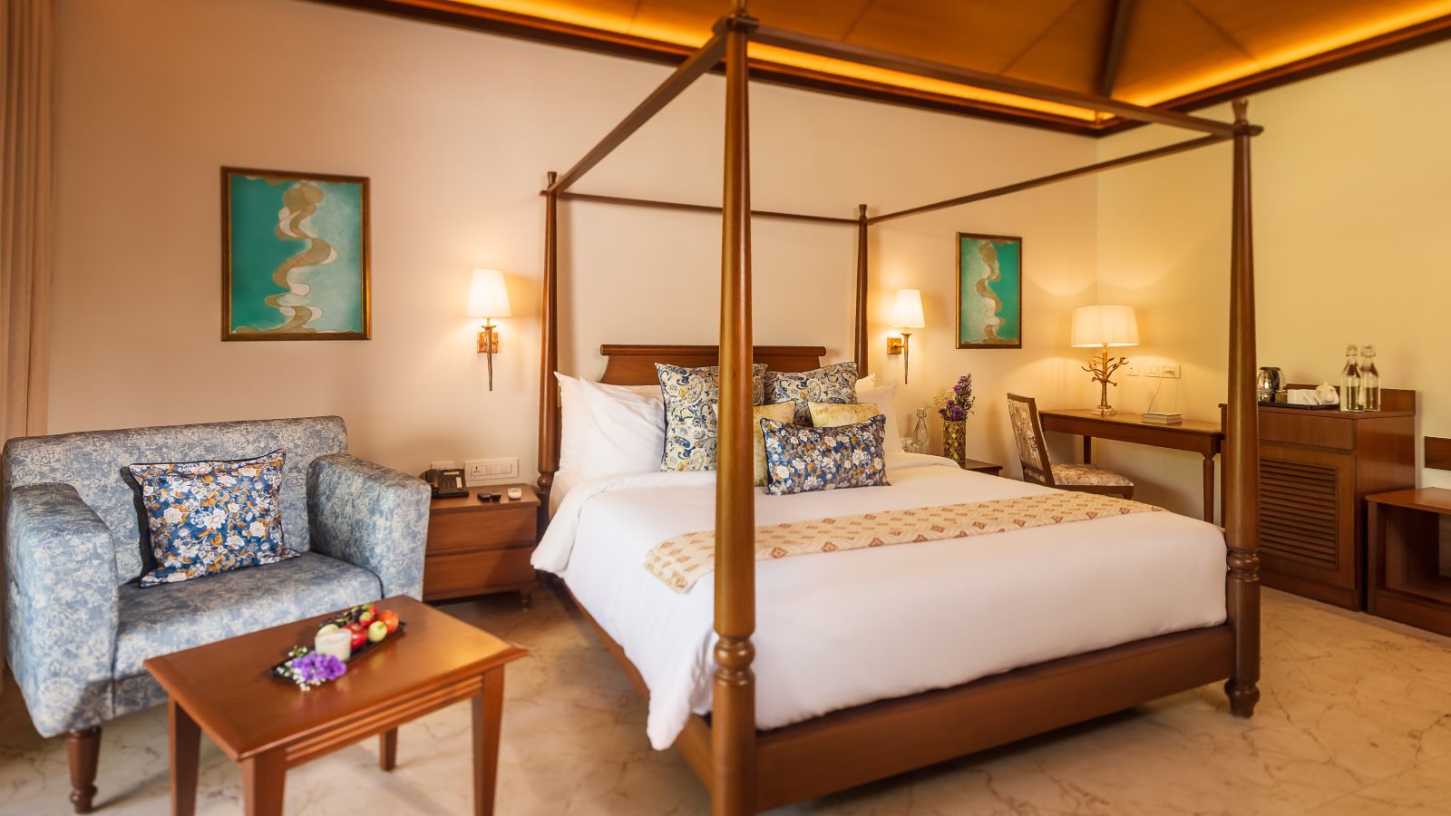 bed and armchair in one of the rooms at our kumta beach stay