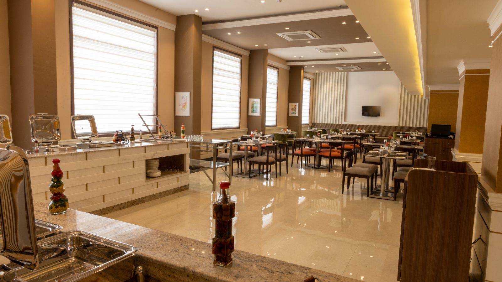 Seating arrangement inside the restaurant - Starlit Suites, Tirupati