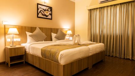 A double bed inside Premium One Bedroom Suite - Starlit Suites, Tirupati