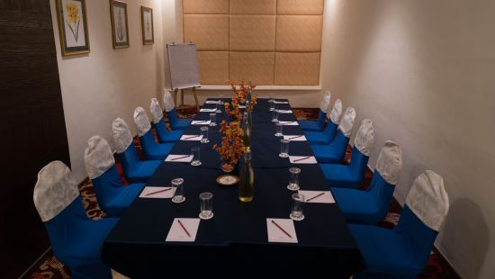 a conference room with lights on  - The Orchid Hotel Pune