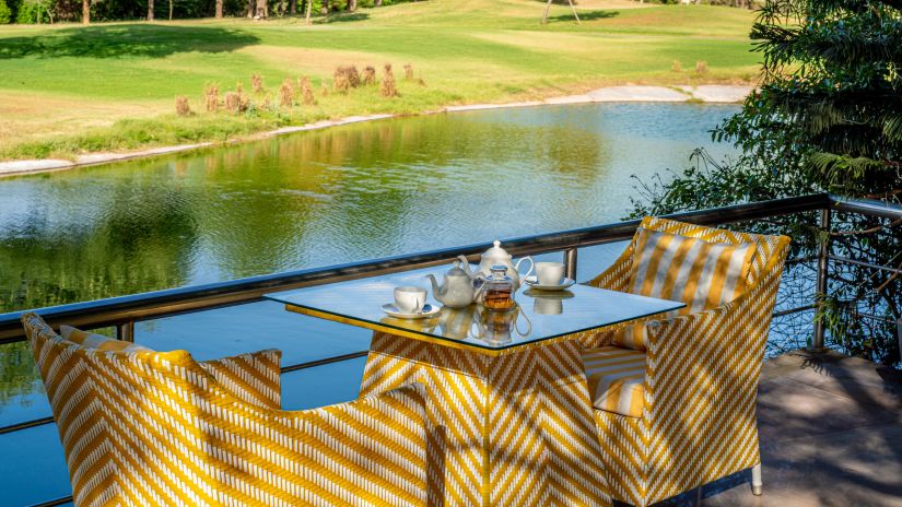 a table set for two with a view of the lake