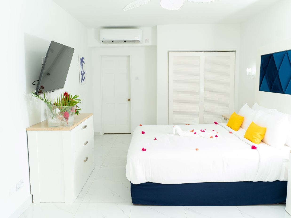 The Soco House - view of a bed facing the TV